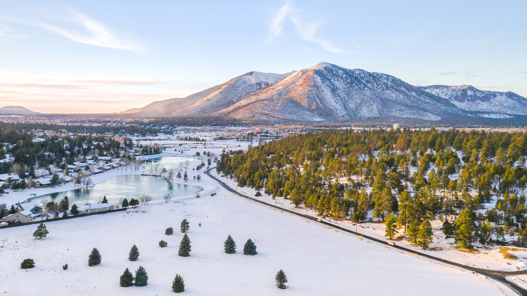 Winter in Northern Arizona. Aerial image of a snow-blanked Mount Elden at sunset in Flagstaff, Arizona.