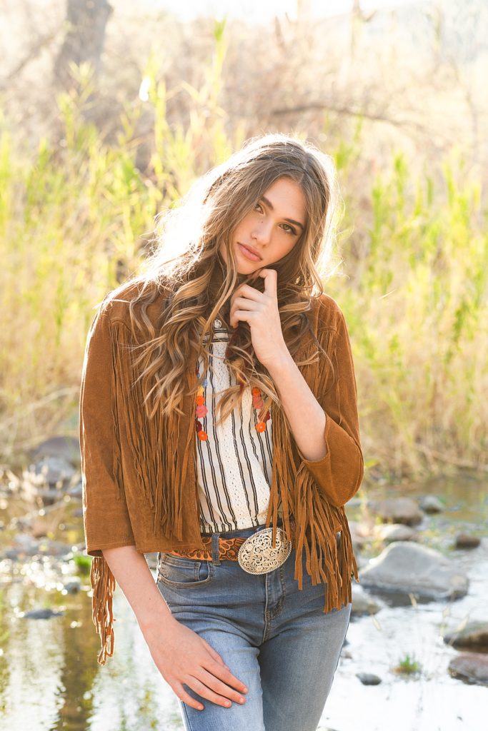 Model Claire provides a soft pose during a beautiful boho portrait session.