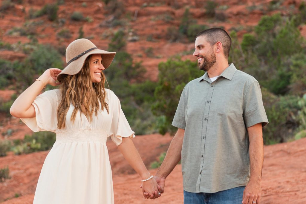 Nick and Bethany smile at each other during an anniversary photo session in Sedona