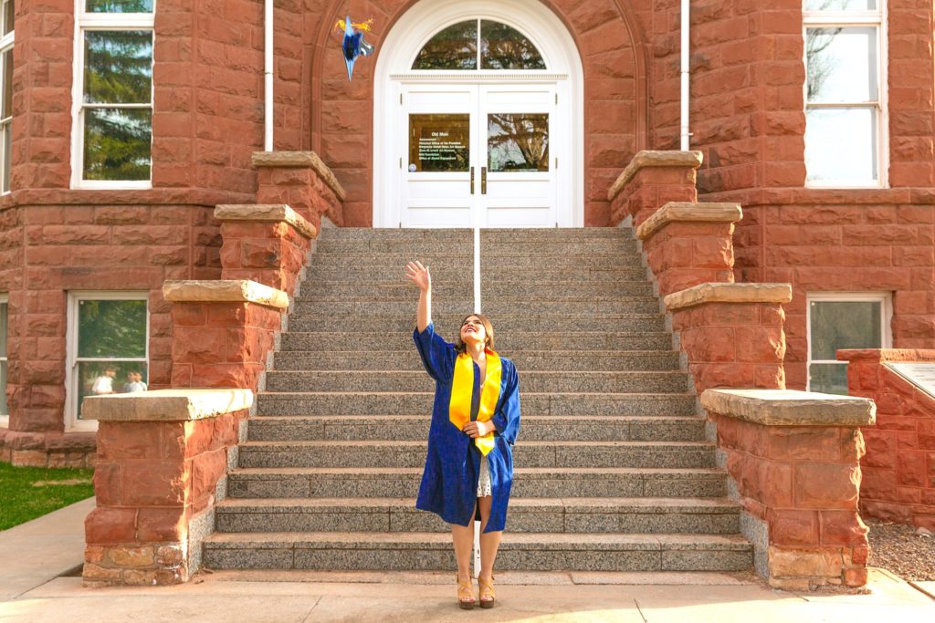 Senior grad Antonela celebrates the Class of 2022 at Northern Arizona University in Flagstaff, Arizona while taking portrait photos. 