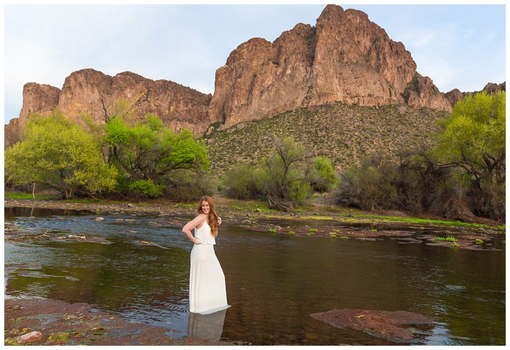 Portrait photography client Alyssa having a ball playing in the Salt River during an Arizona portrait photography session.