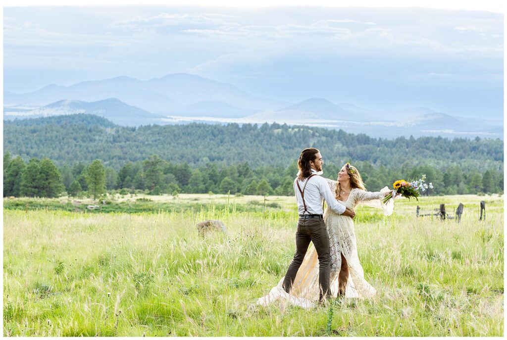 Brooke and Eric dance on a mountaintop during their 10 year anniversary celebration in Flagstaff, Arizona. 