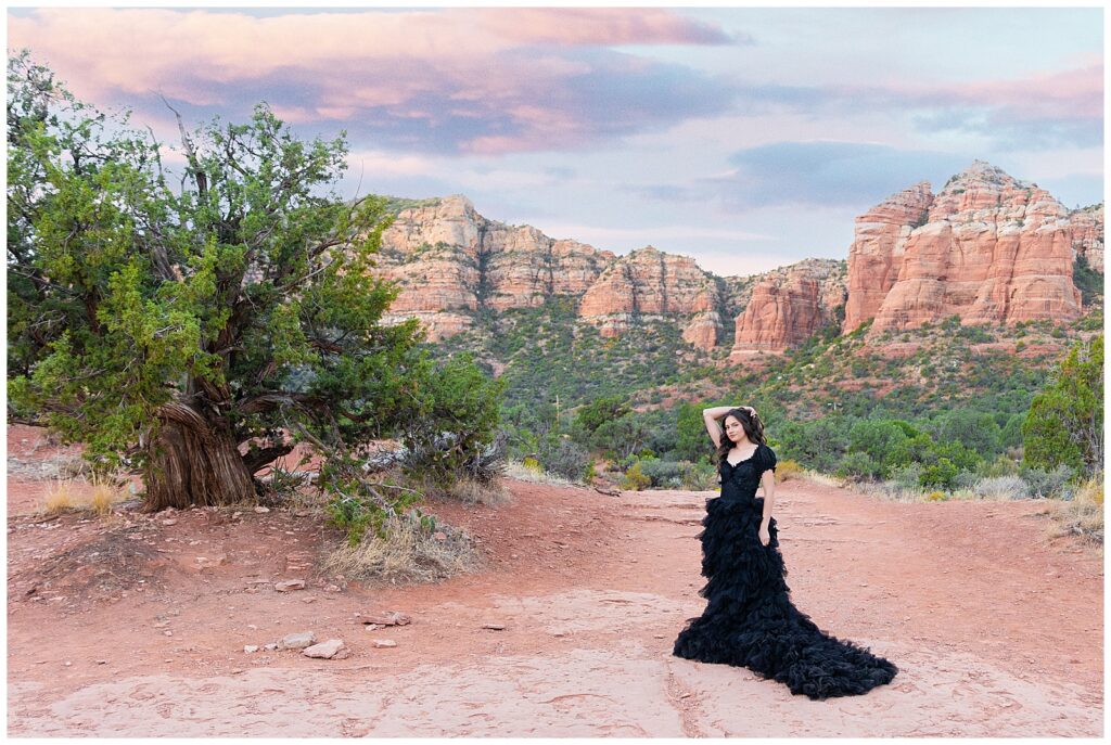 Spellbinding Halloween portrait session in Sedona at sunrise with a stunning model in a long black gown. 