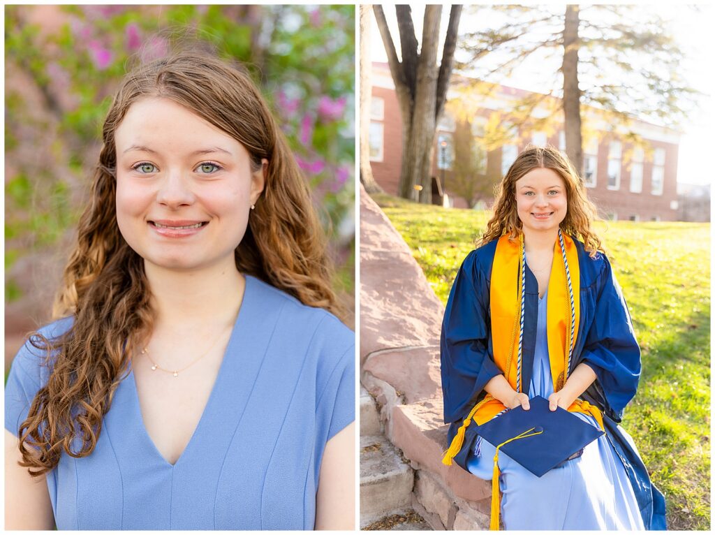 College graduate on the Northern Arizona University campus holding a cap and gown, surrounded by flowers and trees.